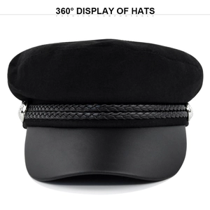 Detail view of black baker boy hat with wool texture, braided rope and silver metal buttons