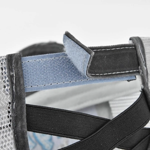 Close-up of the adjustable hook-and-loop strap and elastic crisscross back on a ponytail cap