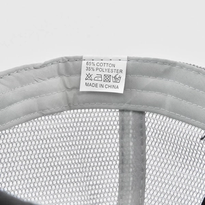 Detail view of cotton blend cap showing washing label and stitching quality