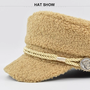 Detail of camel lamb wool baker boy hat with golden rope and vintage metal button
