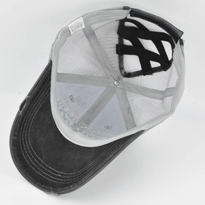 Detail of cross elastic bands for high ponytail on distressed grey mesh baseball cap
