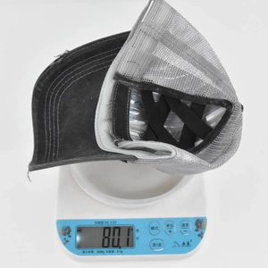 Detail showing the lightweight design of a daisy baseball cap weighing 80.1 grams