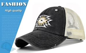 Detail of vintage washed baseball cap with mesh back and geometric embroidery