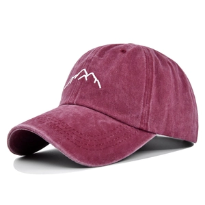 Vintage burgundy washed cotton baseball cap featuring minimalist white mountain embroidery