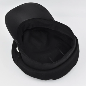 Detail view of black navy hat interior lining with leather brim and silver buckle