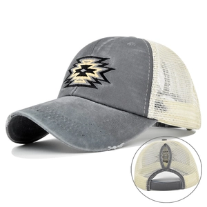 Detail of grey washed baseball cap showing embroidery, breathable mesh, and ponytail hole