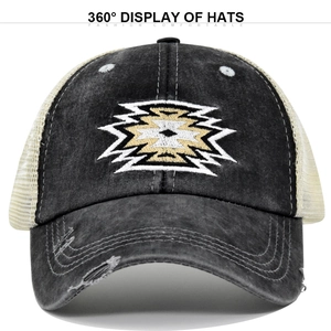 Detail showing vintage washed cotton fabric and geometric embroidery on a mesh baseball cap