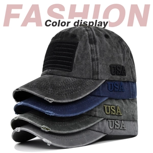 Close-up of vintage washed baseball caps with USA embroidery and distressed brim detail