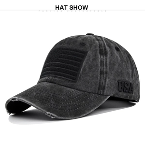 Close-up of distressed brim details and American flag embroidery on washed baseball cap