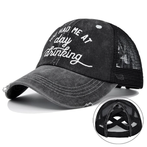 Detail of cross-elastic bands for high ponytail on embroidered grey mesh baseball cap