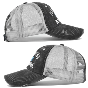 Detail of distressed trucker hat featuring washed cotton fabric and white mesh panels