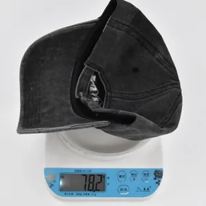 Detailed view showing the baseball cap weight of approximately 78.2 grams on a scale