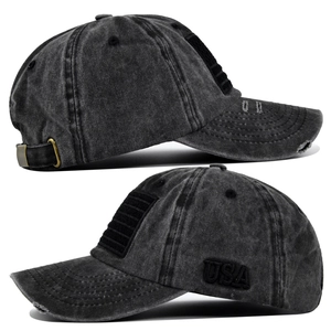 Detail of USA embroidery and distressed brim on gray cotton baseball cap from side views