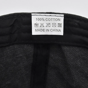 Detail view of the cotton baseball cap inner sweatband and white fabric care label