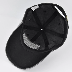 Detailed interior of distressed baseball cap showing cotton sweatband and adjustable buckle