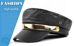 Close-up of black PU leather peaked cap with gold M buckle and textured finish
