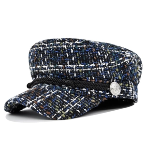 Close-up of mixed tweed texture with decorative black cord and anchor metal button detail