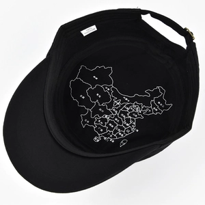 Detail of military flat top cap showing 100% cotton interior lining with map print design