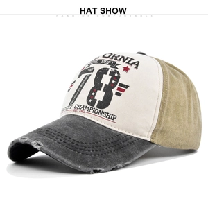 Detailed view of vintage distressed visor and graffiti print on a patchwork baseball cap