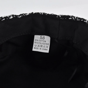 Detail of tweed hat inner lining showing size 58 label and cotton blend material