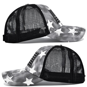 Side view of tie-dye trucker hat with star patterns and breathable black mesh back