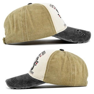 Detail view of washed cotton baseball cap with vintage graffiti and distressed brim