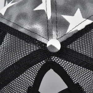 Detail of star pattern fabric and breathable mesh back on the trucker baseball cap