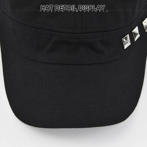 Detail of black cotton cadet hat featuring side silver square rivets and double stitching