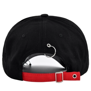 Detail view of the black and red contrast baseball cap showing metal buckle and ring