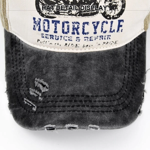 Detail of vintage washed baseball cap featuring motorcycle print and distressed brim