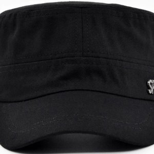 Detail of classic black military flat top hat featuring silver SP metal logo and stitching