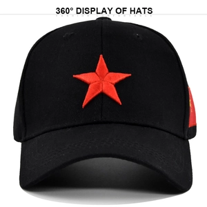 Close-up of 3D red star embroidery and flag detail on a black cotton baseball cap