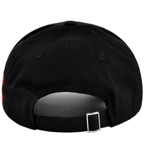 Detail view of the black baseball cap showing cotton fabric texture and metal buckle adjustment