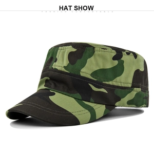 Detail view of cotton twill fabric texture and woodland camouflage pattern on army flat top cap