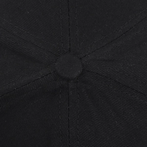 Close-up of black cotton baseball cap top button showing twill fabric and stitching details