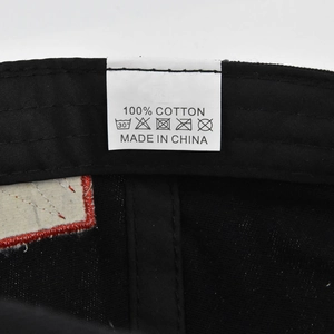 Detailed interior view of 100% cotton baseball cap with fabric care label and stitching