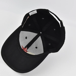 Detail showing 100% cotton inner lining and reinforced seams of a baseball cap