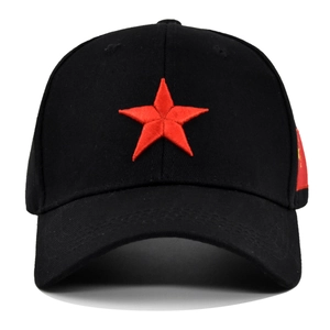 Black cotton baseball cap with red embroidered star and side flag emblem on white background