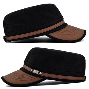 Detail of army cap featuring brown leather brim and embroidered star with metal logo plate