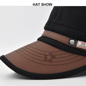 Detailed close-up of brown leather brim with star embroidery and metal fashion plaque