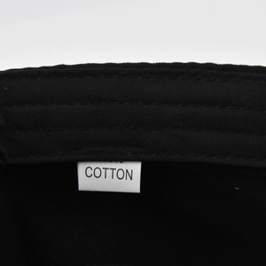Close-up detail of the 100% cotton fabric and material label inside the military hat