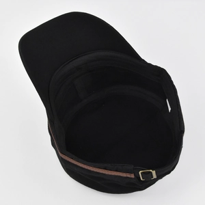 Detail view of cotton military cap interior featuring black sweatband and leather strap