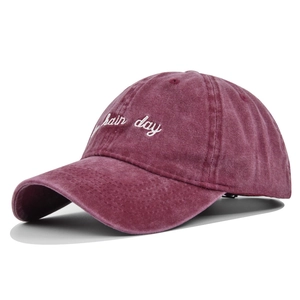 Vintage washed burgundy baseball cap featuring bad hair day white embroidery on front