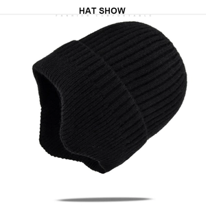 Detail of black ribbed knit beanie featuring thick cuff design and warm acrylic texture
