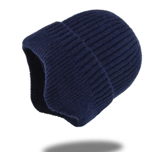 Detail of navy blue rib-knit beanie showing soft acrylic texture and adjustable cuff