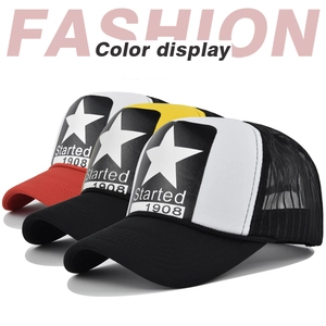 Detailed view of mesh trucker hats with star print in red, yellow, and black colors