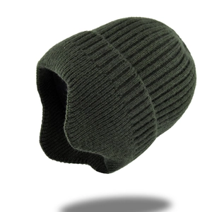 Close-up of deep green knit beanie featuring thick vertical rib texture and folded cuff