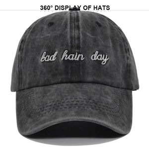 Detailed view of bad hair day 3D embroidery on washed vintage dark denim baseball cap