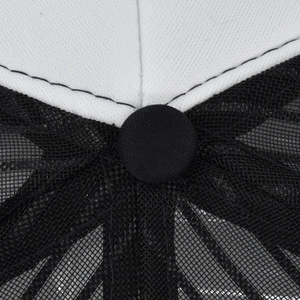 Close-up of mesh trucker hat top showing black contrast stitching and white fabric button