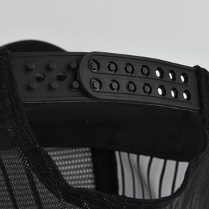 Detail of adjustable snapback closure and breathable mesh texture on the black cap